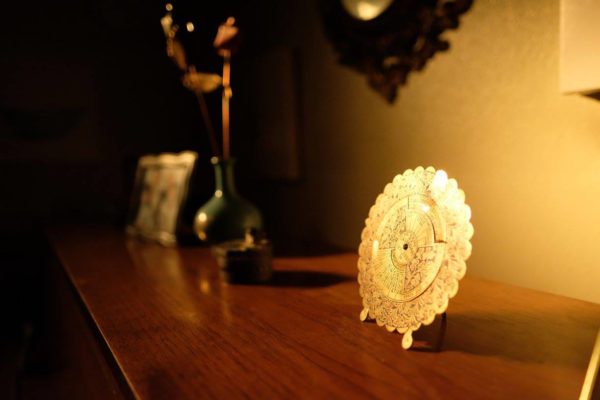 Sentimental objects sitting on top of a piano.