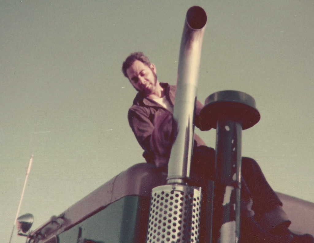 John A. Walker sitting on top of a truck.
