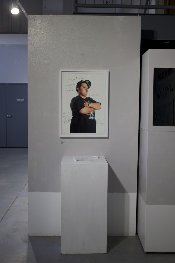 The Exquisite Lumbees and Hard Workin' Pilgrims exhibit; photos on walls.