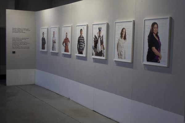 The Exquisite Lumbees and Hard Workin' Pilgrims exhibit; photos on walls.