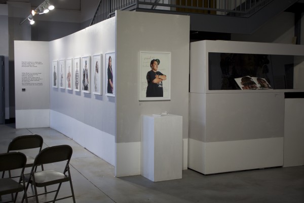 The Exquisite Lumbees and Hard Workin' Pilgrims exhibit; photos on walls.