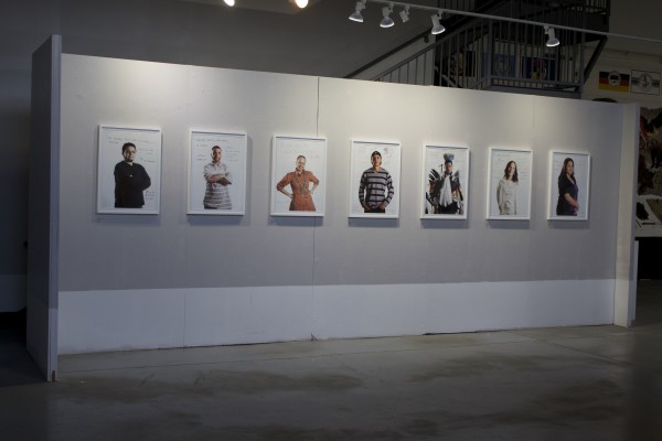 The Exquisite Lumbees and Hard Workin' Pilgrims exhibit; photos on walls.