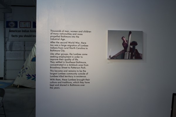 The Exquisite Lumbees and Hard Workin' Pilgrims exhibit; photos on walls.
