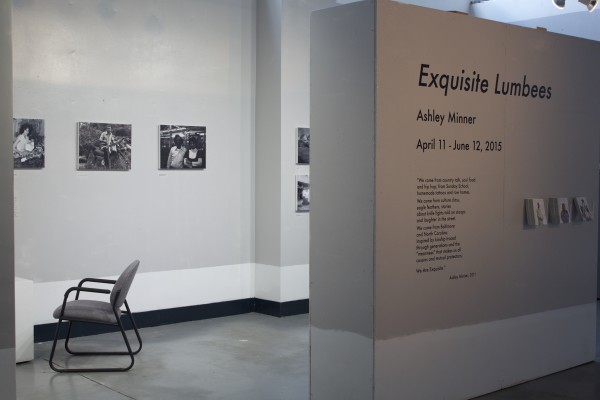 The Exquisite Lumbees and Hard Workin' Pilgrims exhibit; photos on walls.