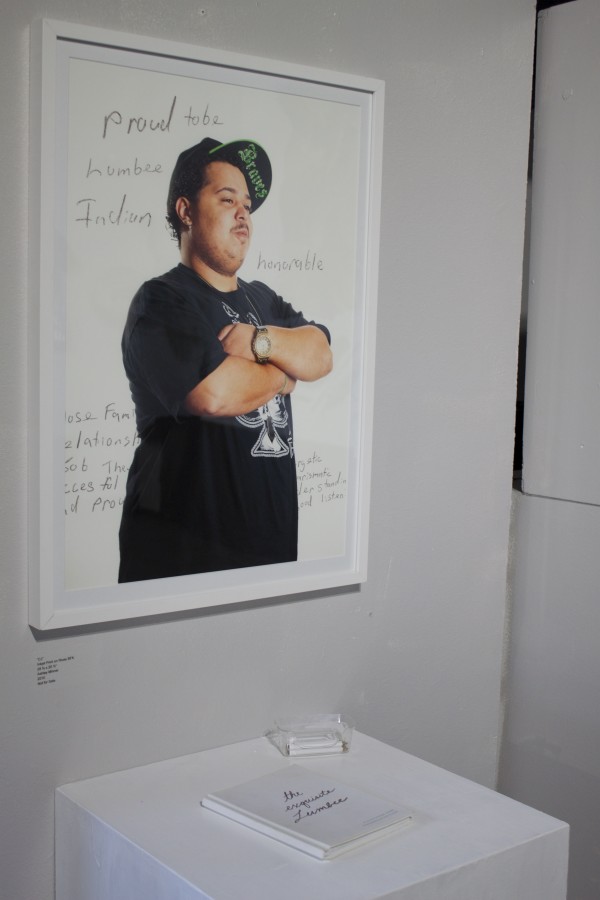 The Exquisite Lumbees and Hard Workin' Pilgrims exhibit; photos on walls.