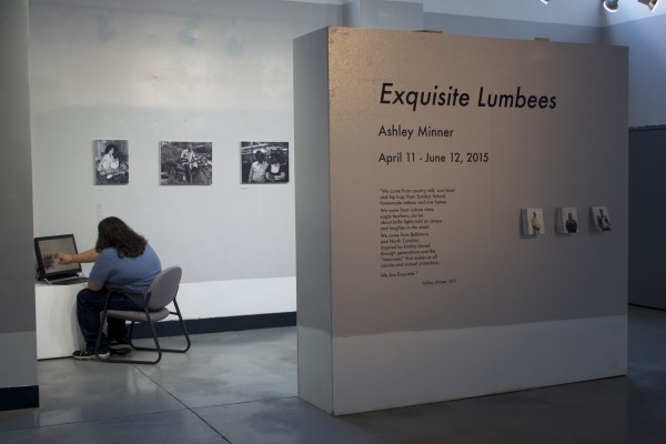 The Exquisite Lumbees and Hard Workin' Pilgrims exhibit; photos on walls.