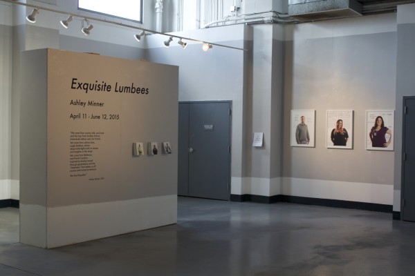 The Exquisite Lumbees and Hard Workin' Pilgrims exhibit; photos on walls.