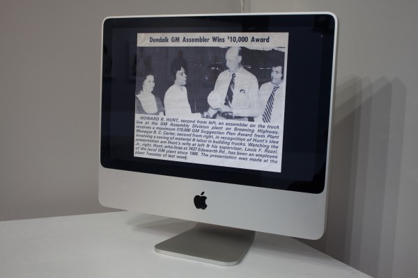 Photos displayed in the exhibit on a computer screen.