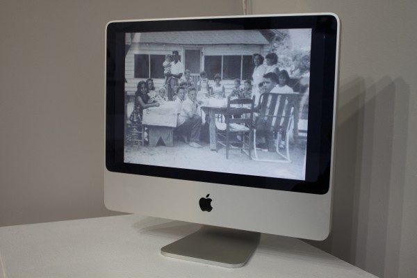 Photos displayed in the exhibit on a computer screen.