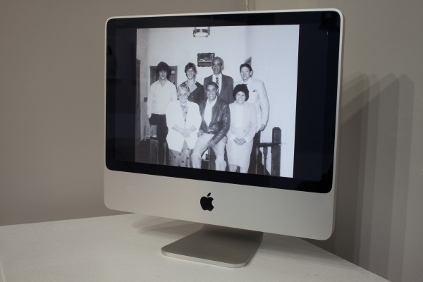 Photos displayed in the exhibit on a computer screen.