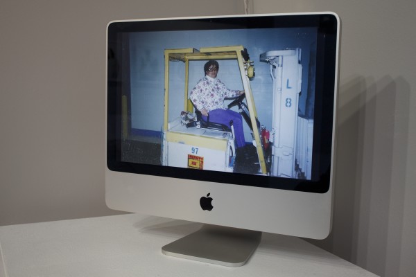 Photos displayed in the exhibit on a computer screen.