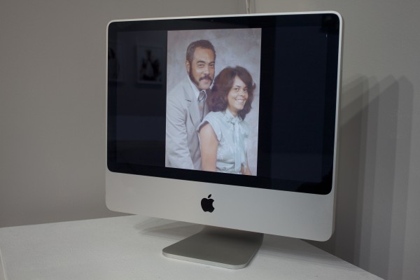 Photos displayed in the exhibit on a computer screen.