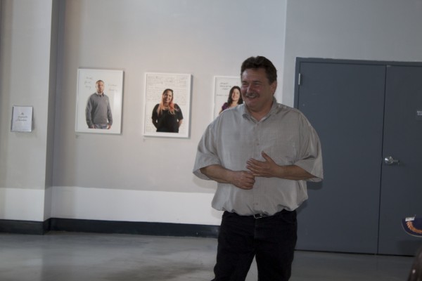 People viewing the Exquisite Lumbees and Hard Workin' Pilgrims exhibit.