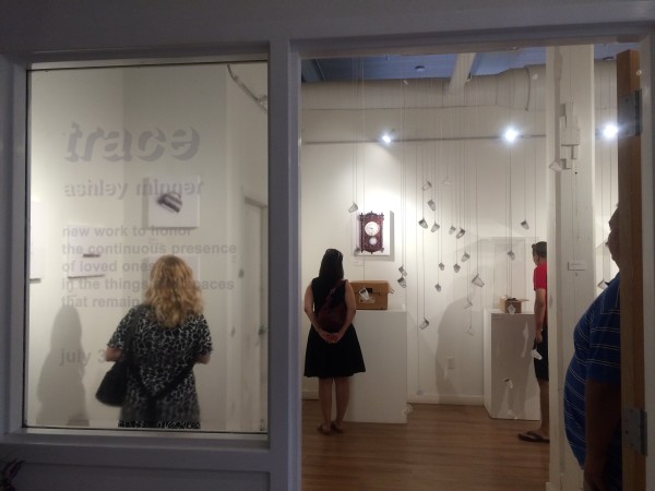 Attendees viewing the objects in the installation.