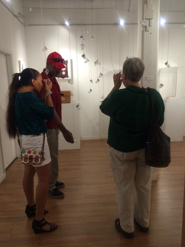 Attendees viewing the objects in the installation.