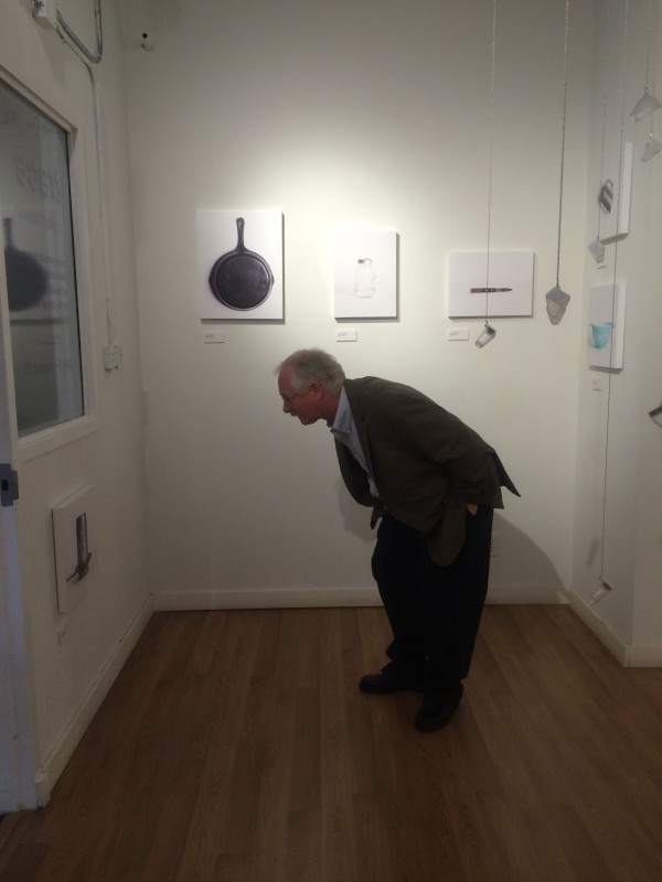 Attendees viewing the objects in the installation.