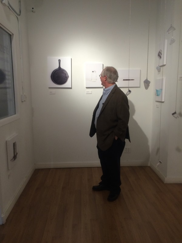 Attendees viewing the objects in the installation.