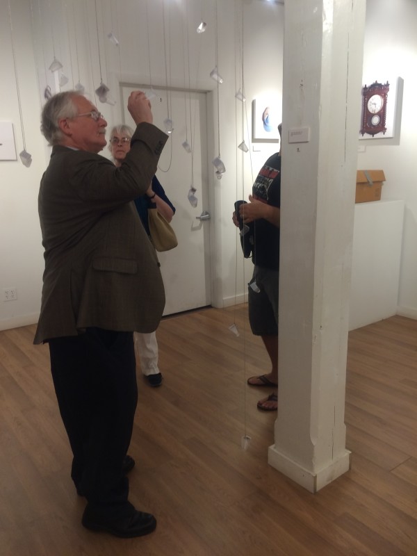 Attendees viewing the objects in the installation.