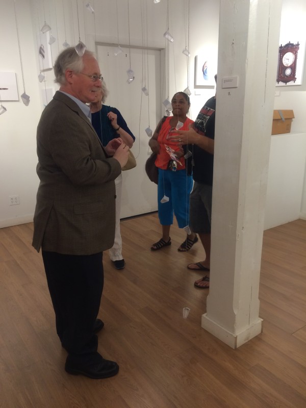 Attendees viewing the objects in the installation.
