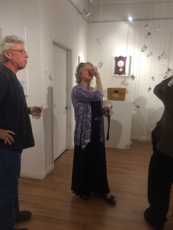 Attendees viewing the objects in the installation.