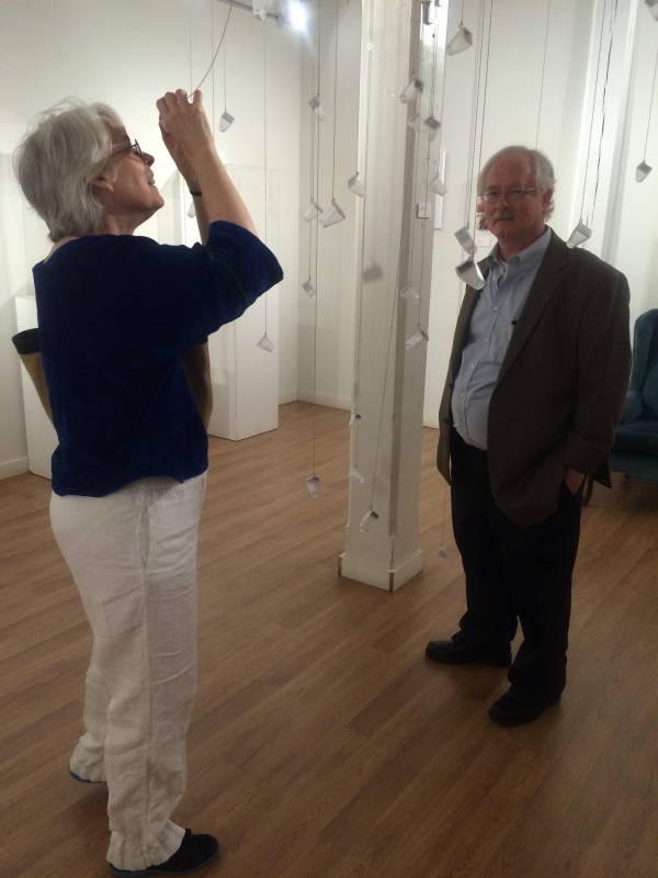 Attendees viewing the objects in the installation.