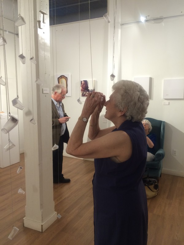 Attendees viewing the objects in the installation.