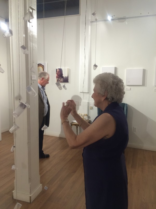 Attendees viewing the objects in the installation.