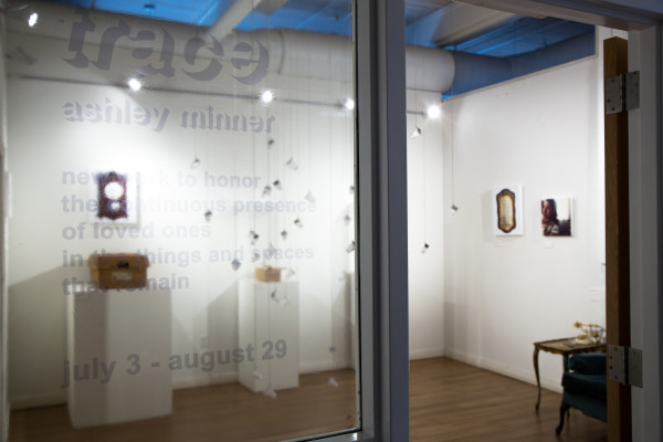 The event title sign on a glass panel.