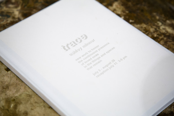 A book with the installation's title on the front.