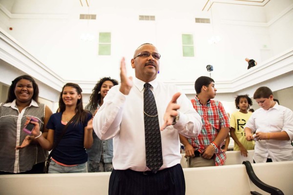 A performer clapping.