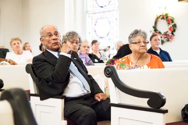 Audience members seated.