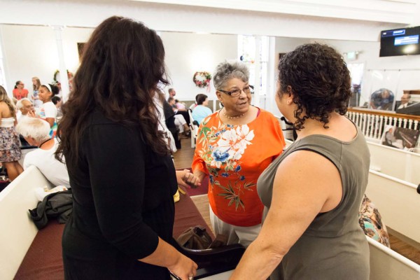 Attendees speaking with each other.
