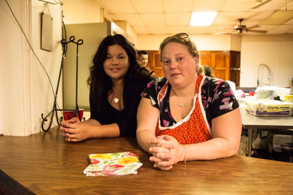 Ashley Minner smiling beside an attendee.