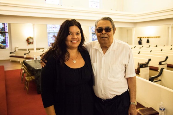 Ashley Minner smiling beside an attendee.