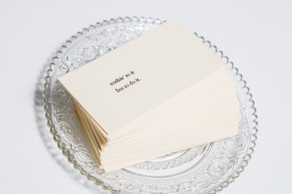 A stack of letterpress-printed cards, with text reading, Nothing to it but to do it.