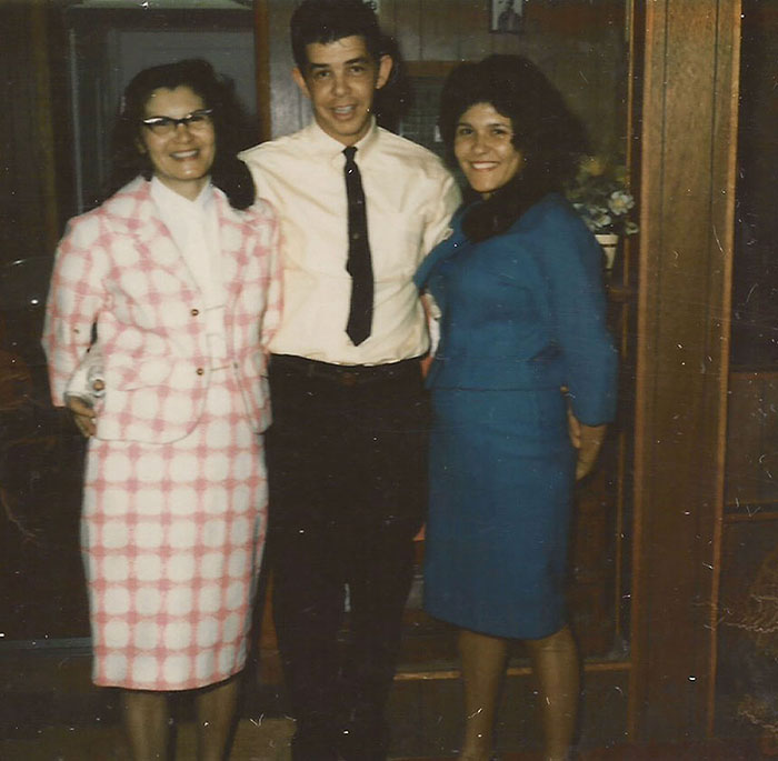 Linda Cox smiling, standing with several others.