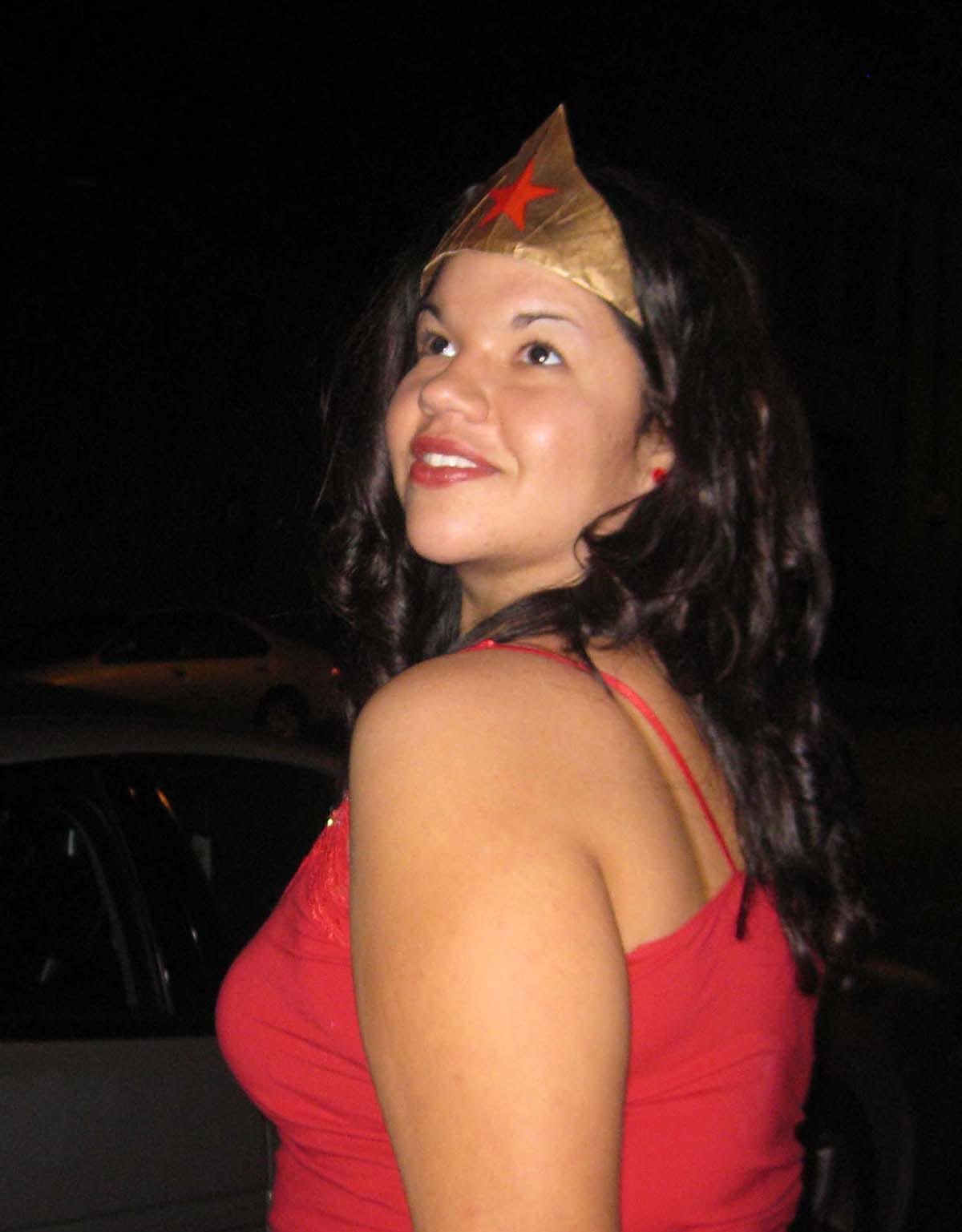 Ashley Minner smiling, wearing a Wonder Woman crown.