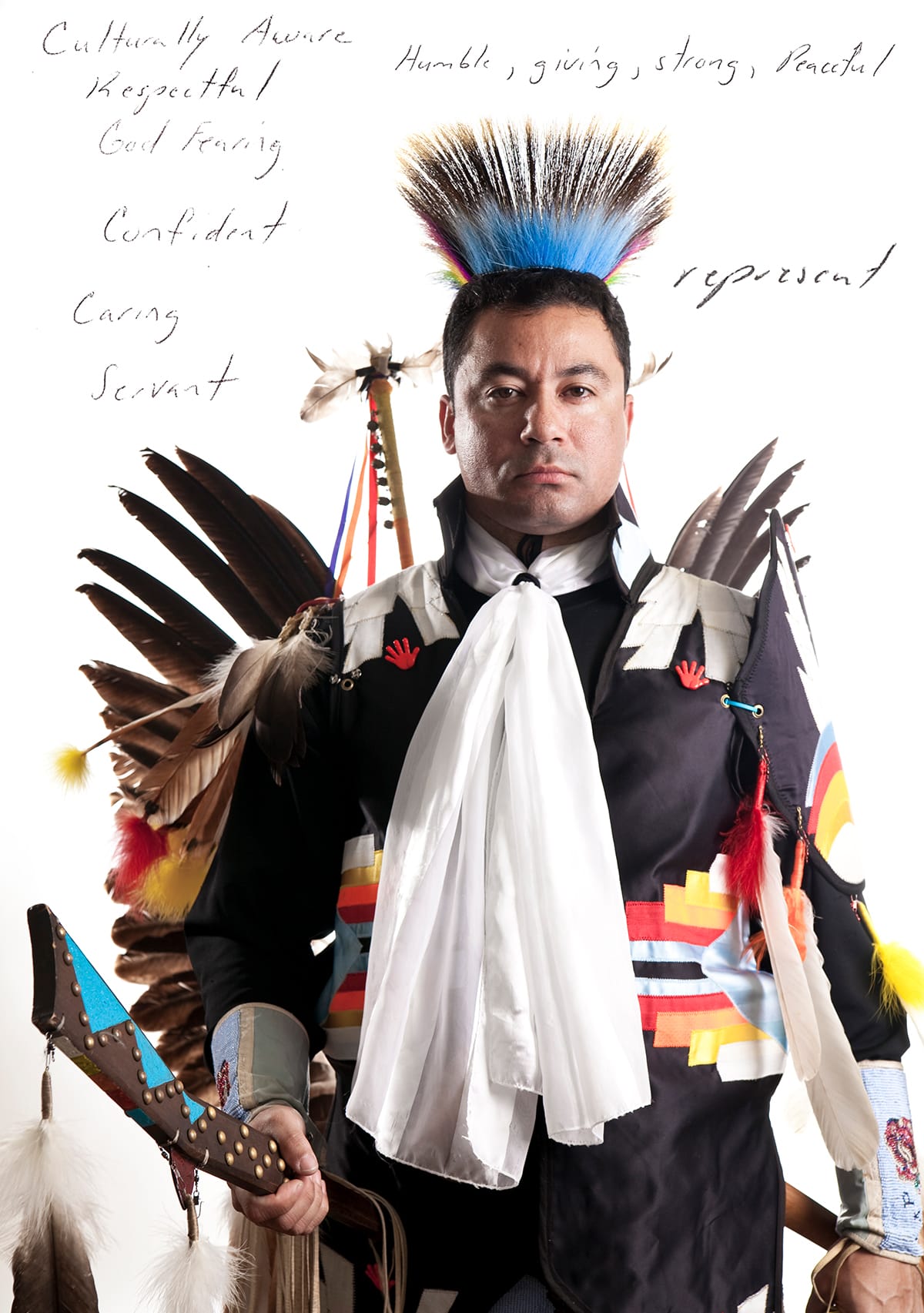 Photo of Keith in Lumbee regalia. Text reads, Culturally aware, respectful, god-fearing.