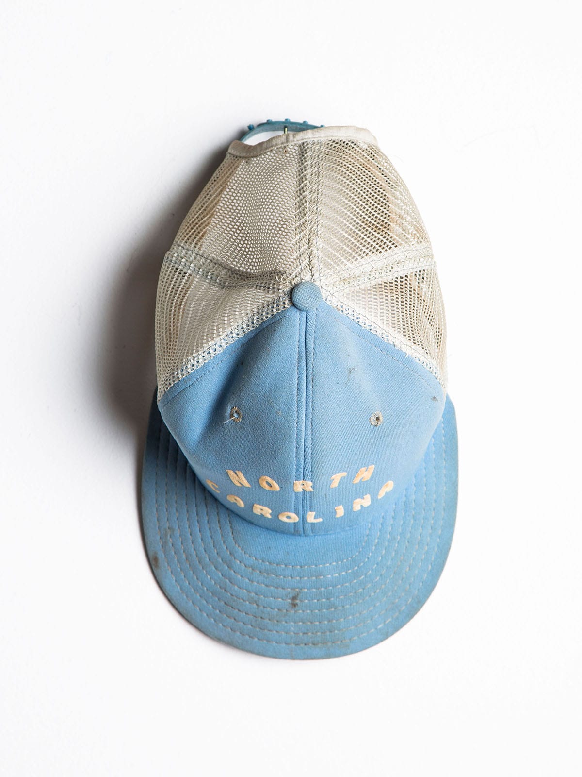 Ashley Minner's father's old gardening baseball hat.